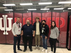 Joshua Streiff and 4 others in front of IU Big Red sign